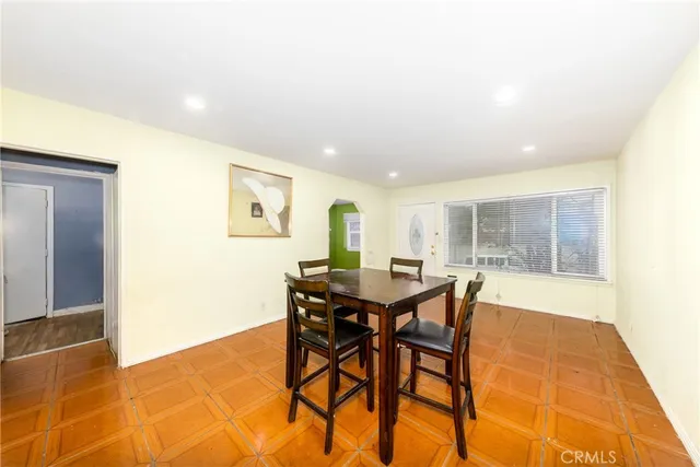 a view of a dining room with furniture and window