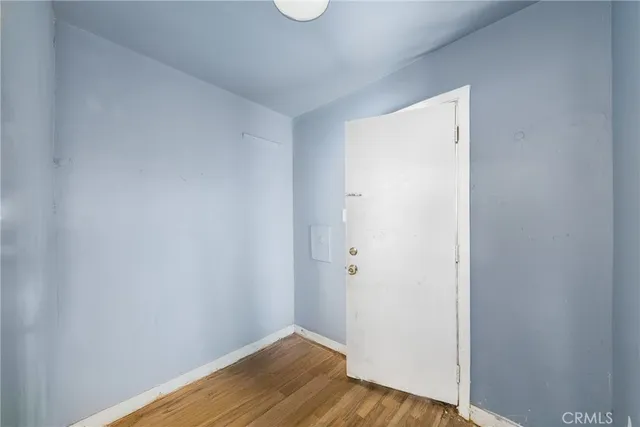 a view of a small space with wooden floor