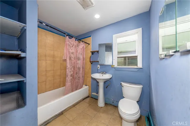 a bathroom with a toilet sink and bathtub