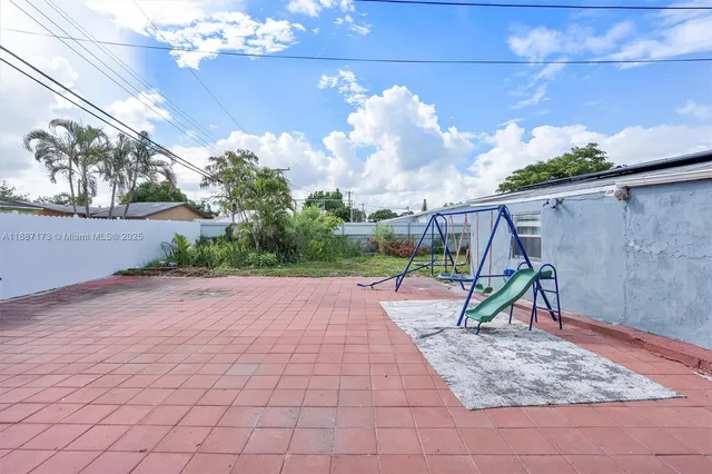 a view of a park with a slide