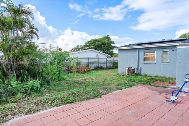 a house view with a backyard space