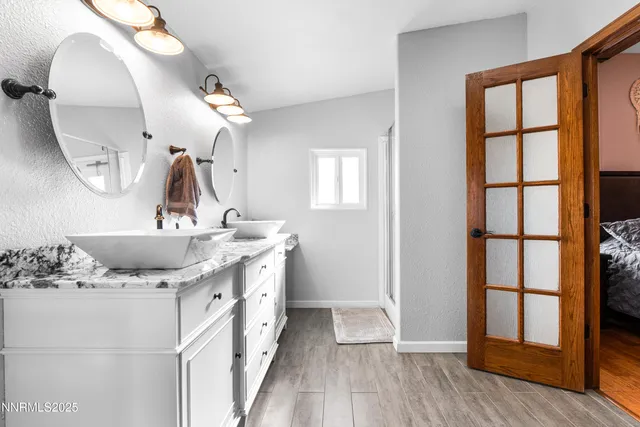 a bathroom with a glass shower door
