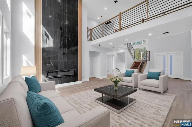 a living room with furniture rug and lamp