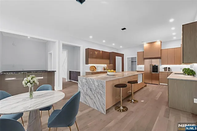 a living room with kitchen island furniture and a table