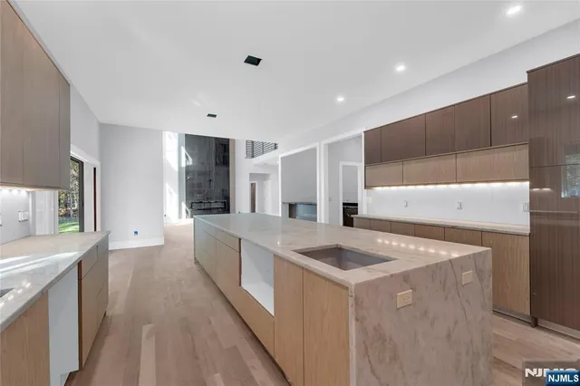 a kitchen that has a sink and a stove in it