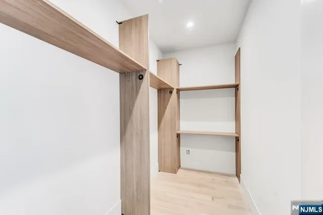 a bathroom with a tub a sink and a shower