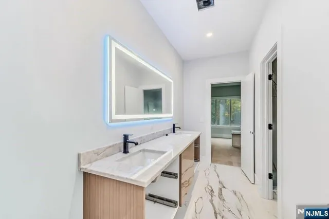 a white toilet sitting next to a shower