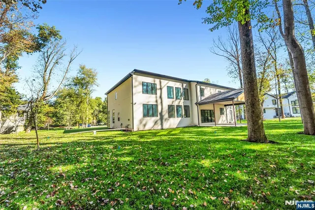a view of a swimming pool with a yard