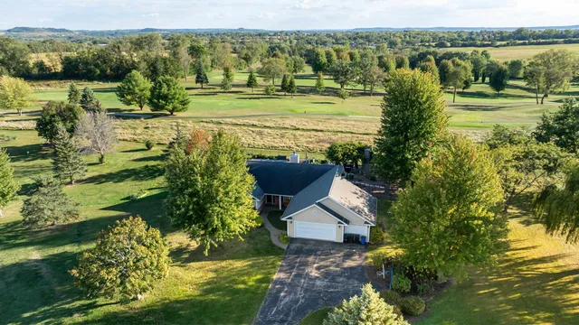a view of a lake with a yard and mountain view