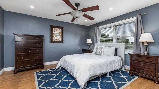 a bedroom with a bed and a dresser