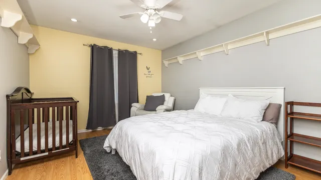 a bedroom with a bed and a couch