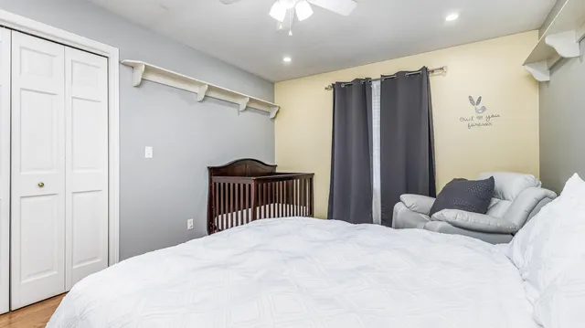 a bathroom with a toilet a sink and a mirror
