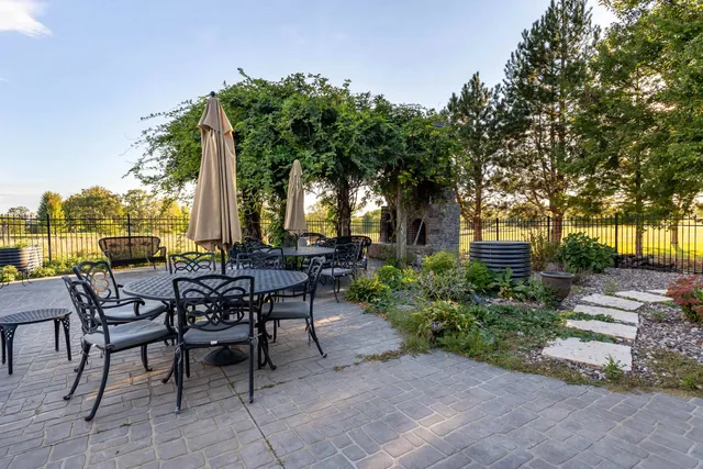 an aerial view of house with yard and outdoor seating