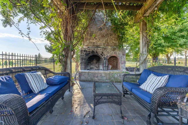 an aerial view of a house with yard swimming pool and outdoor seating