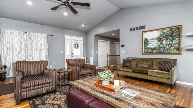a living room with furniture and a large window