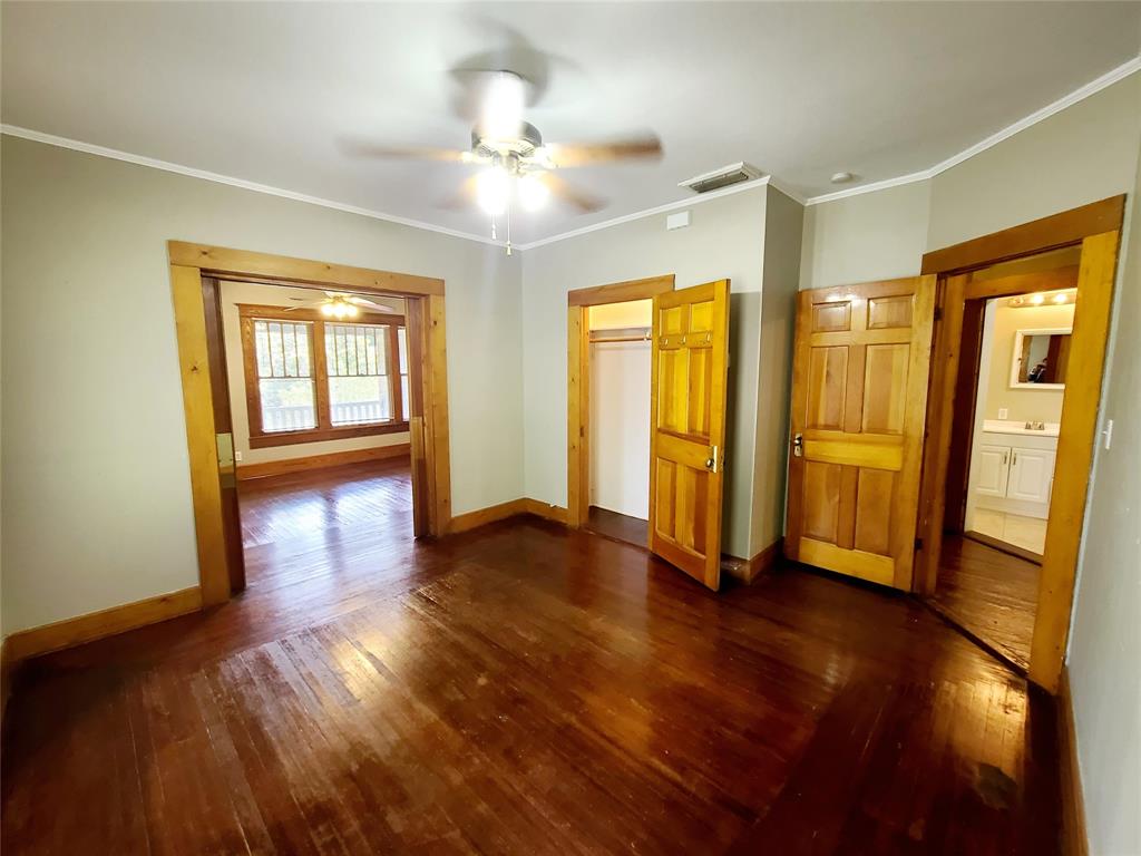 4911 Worth Street, Unit 4 Dallas, TX 75214 - Photo 13 of 28 a view of an empty room with wooden floor and a window
