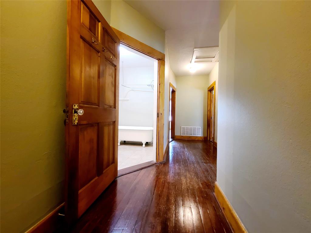 4911 Worth Street, Unit 4 Dallas, TX 75214 - Photo 19 of 28 a view of a hallway with wooden floor