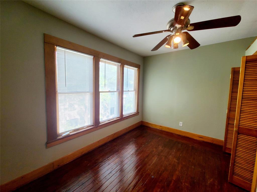 4911 Worth Street, Unit 4 Dallas, TX 75214 - Photo 21 of 28 a view of empty room with wooden floor and fan