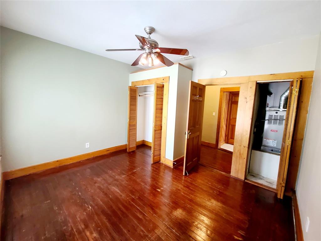 4911 Worth Street, Unit 4 Dallas, TX 75214 - Photo 22 of 28 wooden floor in an empty room with a window