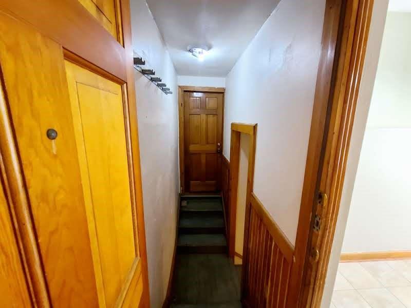 4911 Worth Street, Unit 4 Dallas, TX 75214 - Photo 24 of 28 a view of a hallway with wooden floor and stairs