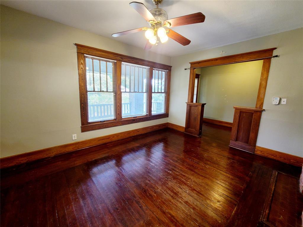 4911 Worth Street, Unit 4 Dallas, TX 75214 - Photo 7 of 28 a view of empty room with wooden floor and fan