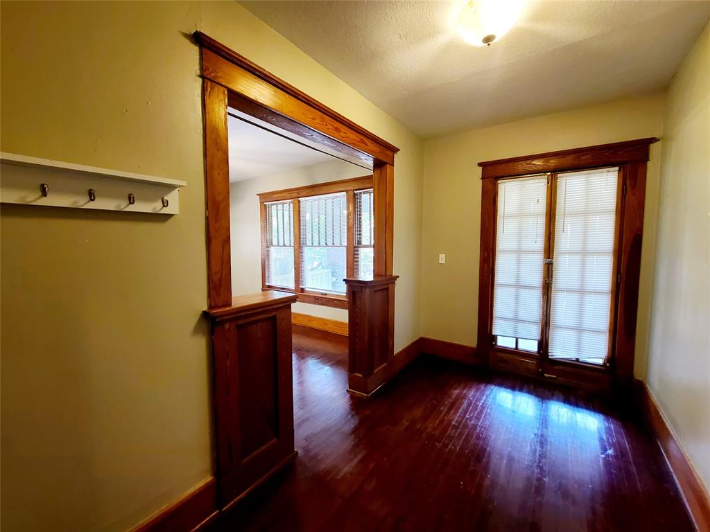 4911 Worth Street, Unit 4 Dallas, TX 75214 - Photo 8 of 28 wooden floor in an empty room with a window