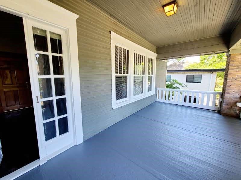 4911 Worth Street, Unit 4 Dallas, TX 75214 - Photo 9 of 28 a view of an empty room with a window and wooden floor