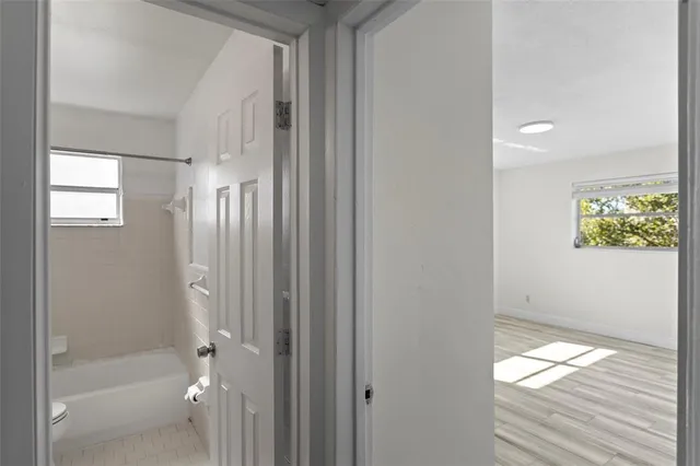 a bathroom with a bathtub and shower