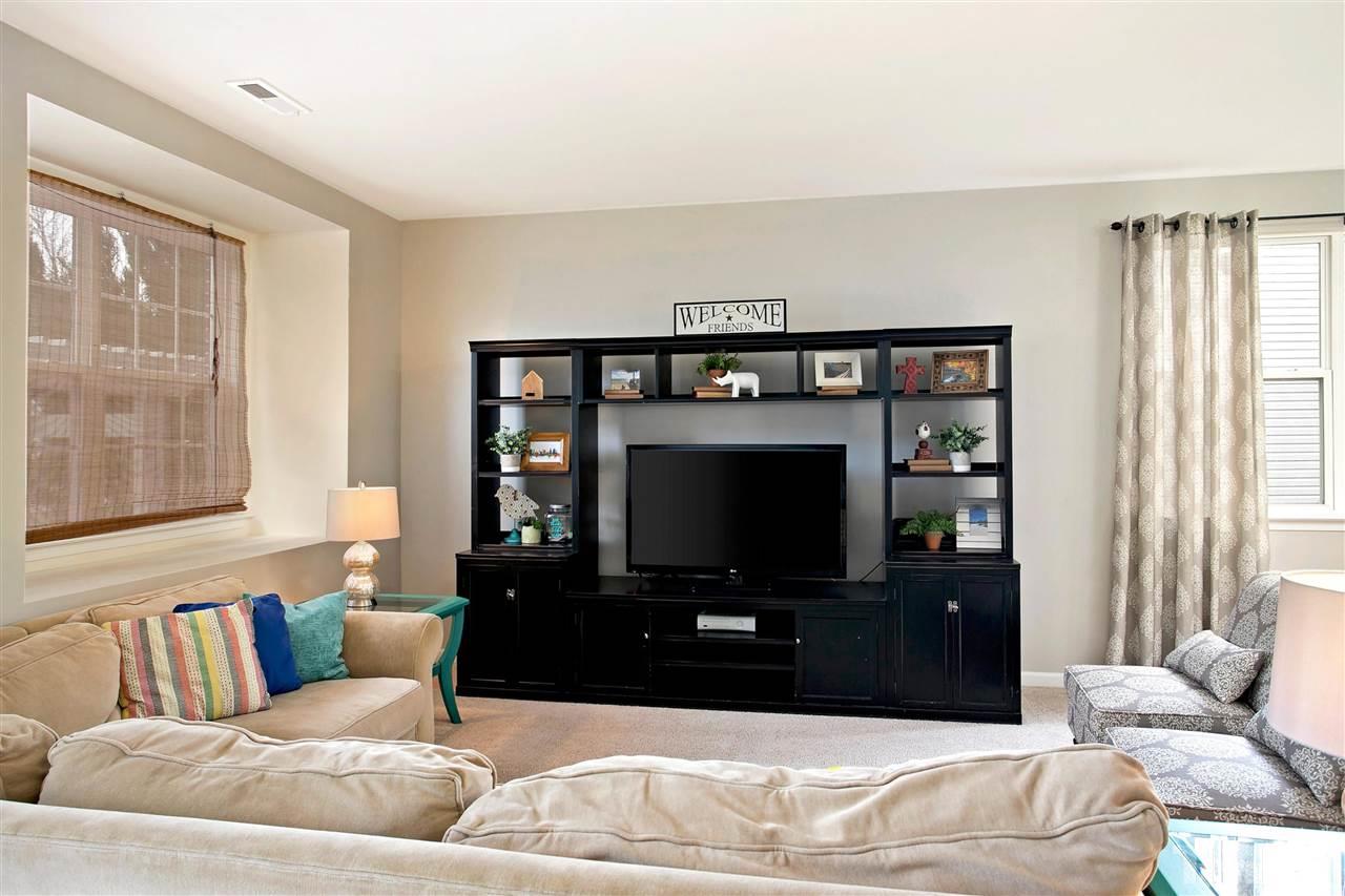 This Large cozy space is great for families to hang out.  Room is large enough to be a family & formal Living Room.  Natural Light Makes this space you desire to spend time in.