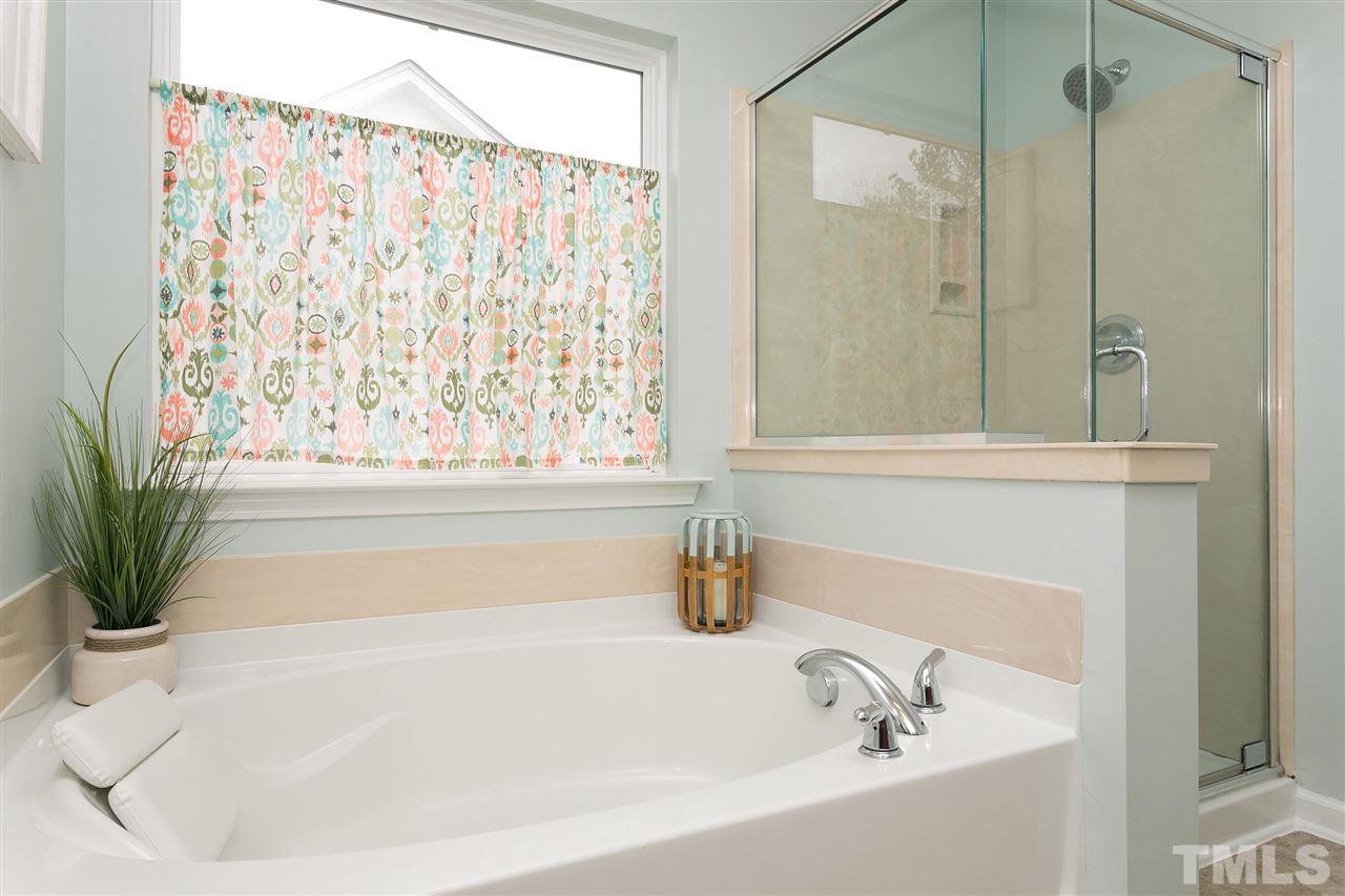 312 Rondelay Drive Durham, NC 27703 - Photo 12 of 25 This Master Spa is well appointed. Dual Sinks, Champagne Tub and Separate Shower. Relax and enjoy!