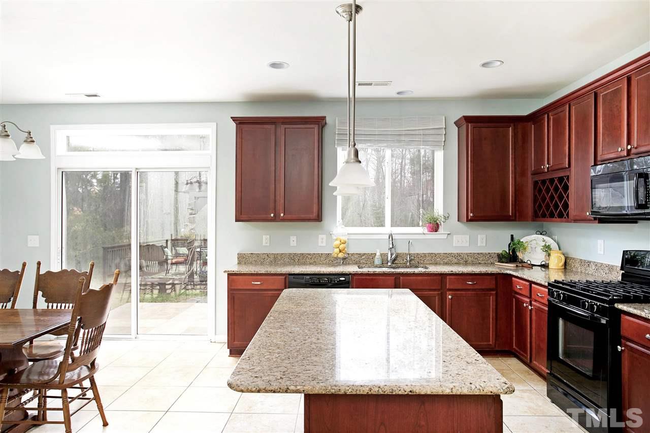 Tile flooring, Granite Counters, Large Center Island, Pendant Lights and Top Hat lighting.  Come see all this home has to offer.