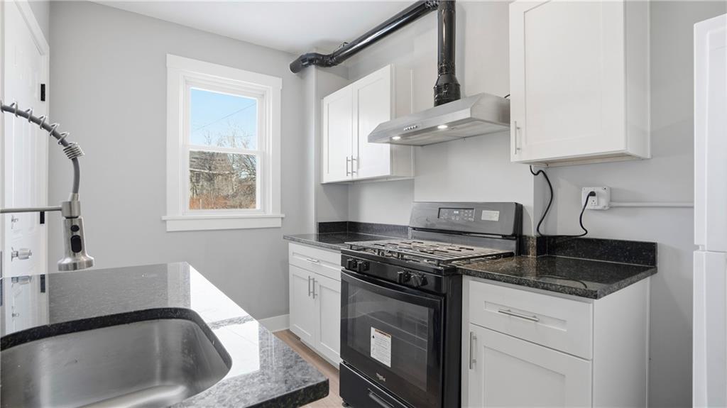 613 Paulson Avenue Pittsburgh, PA 15206 - Photo 15 of 32 a kitchen with stainless steel appliances granite countertop a sink stove and cabinets
