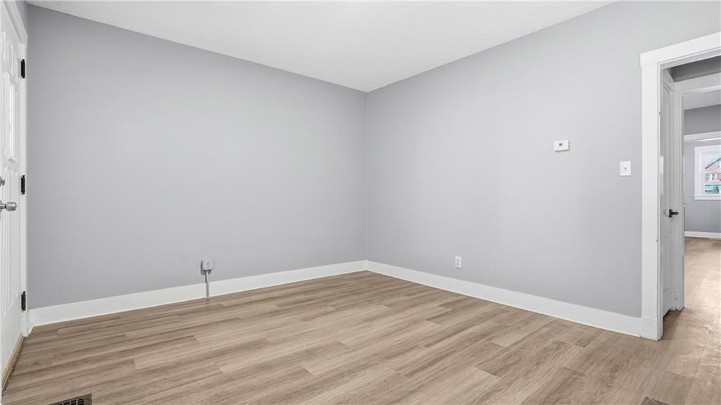 613 Paulson Avenue Pittsburgh, PA 15206 - Photo 9 of 32 a view of an empty room with wooden floor