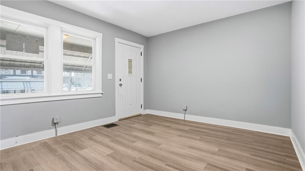 613 Paulson Avenue Pittsburgh, PA 15206 - Photo 10 of 32 a view of empty room with wooden floor and fan