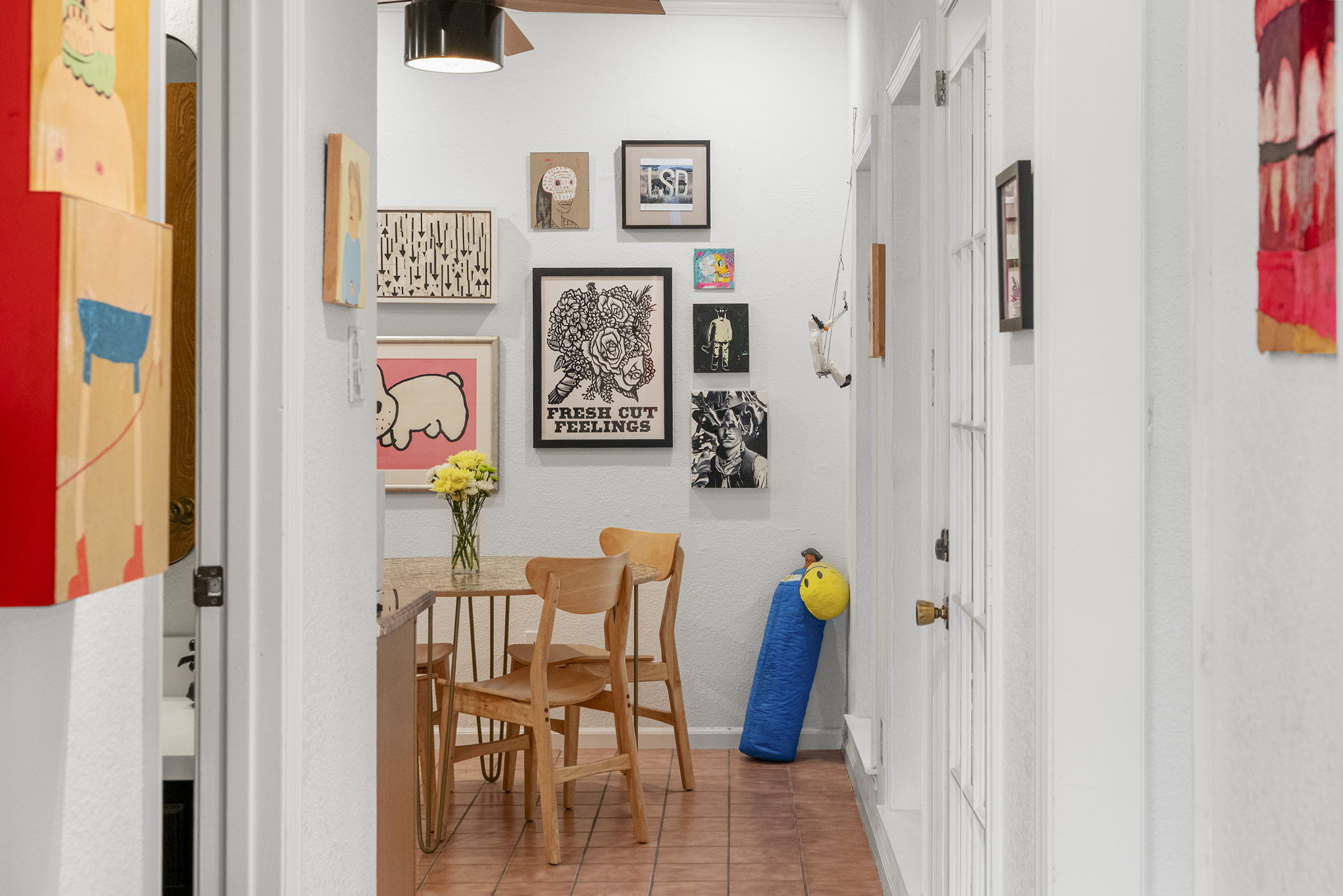400 Hackberry Street Lockhart, TX 78644 - Photo 18 of 40 A well-lit corridor featuring warm tiled flooring and a convenient dining nook.