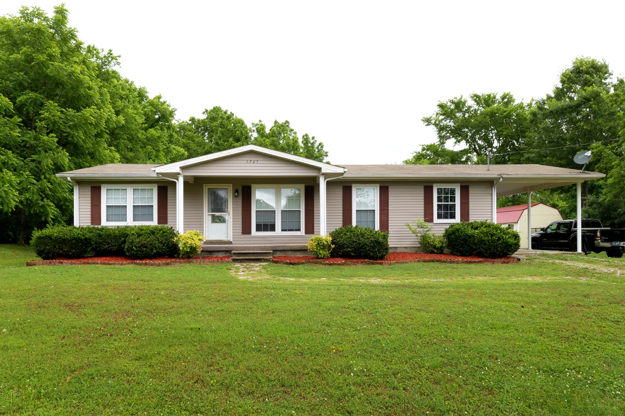 1265 Iron Bridge Road Columbia, TN 38401 - Photo 1 of 34 a front view of a house with a yard