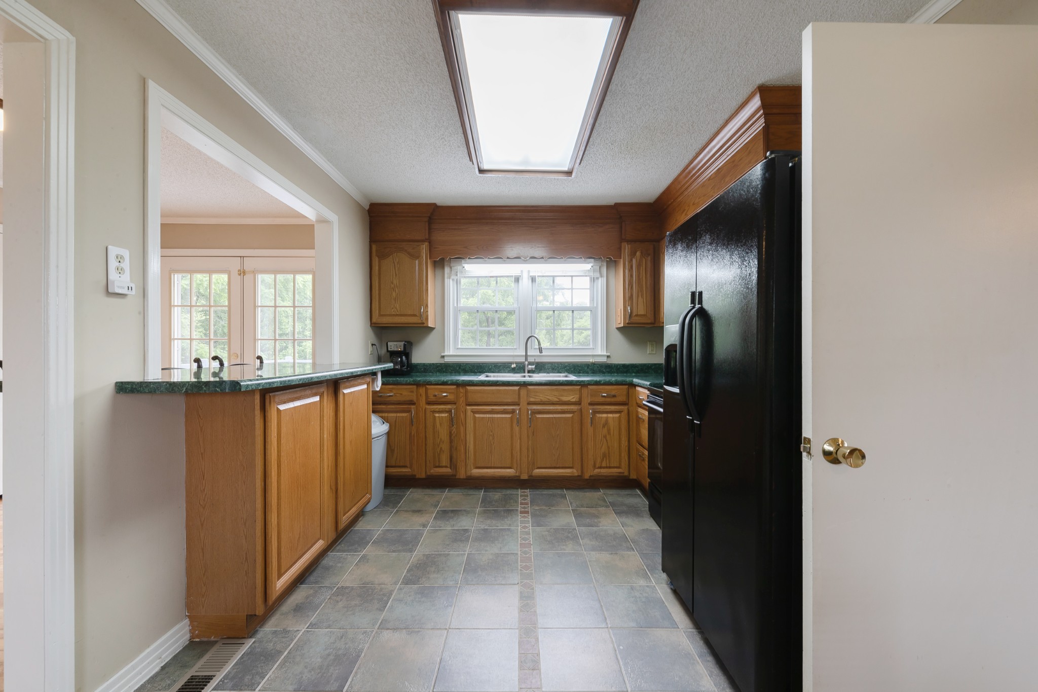 1265 Iron Bridge Road Columbia, TN 38401 - Photo 12 of 34 a large kitchen with granite countertop a refrigerator and a sink
