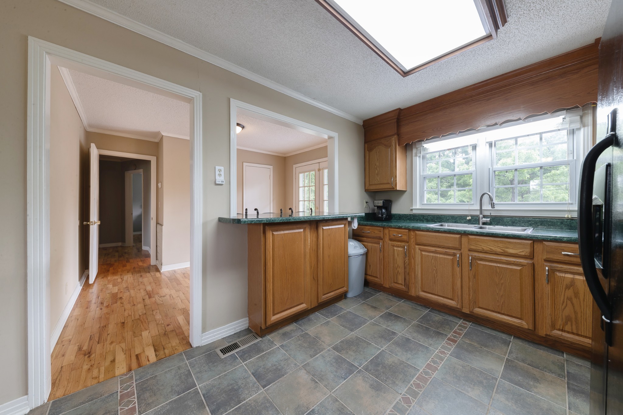 1265 Iron Bridge Road Columbia, TN 38401 - Photo 14 of 34 a large kitchen with stainless steel appliances granite countertop a refrigerator and a sink