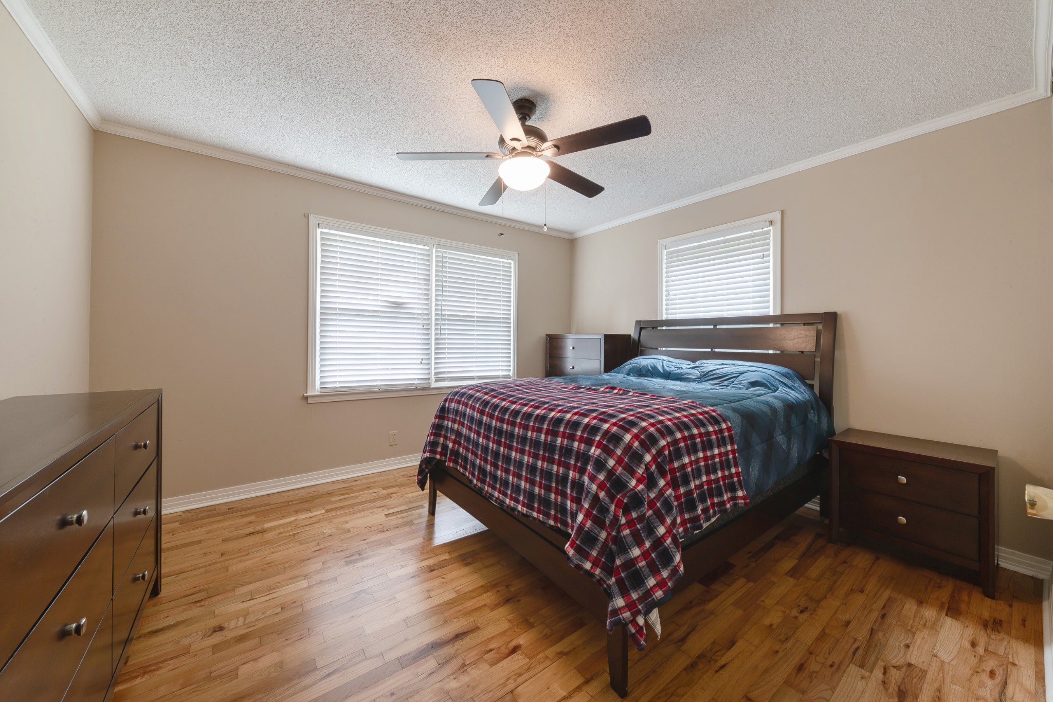 1265 Iron Bridge Road Columbia, TN 38401 - Photo 19 of 34 a bed sitting in a bedroom next to a window and a chandelier