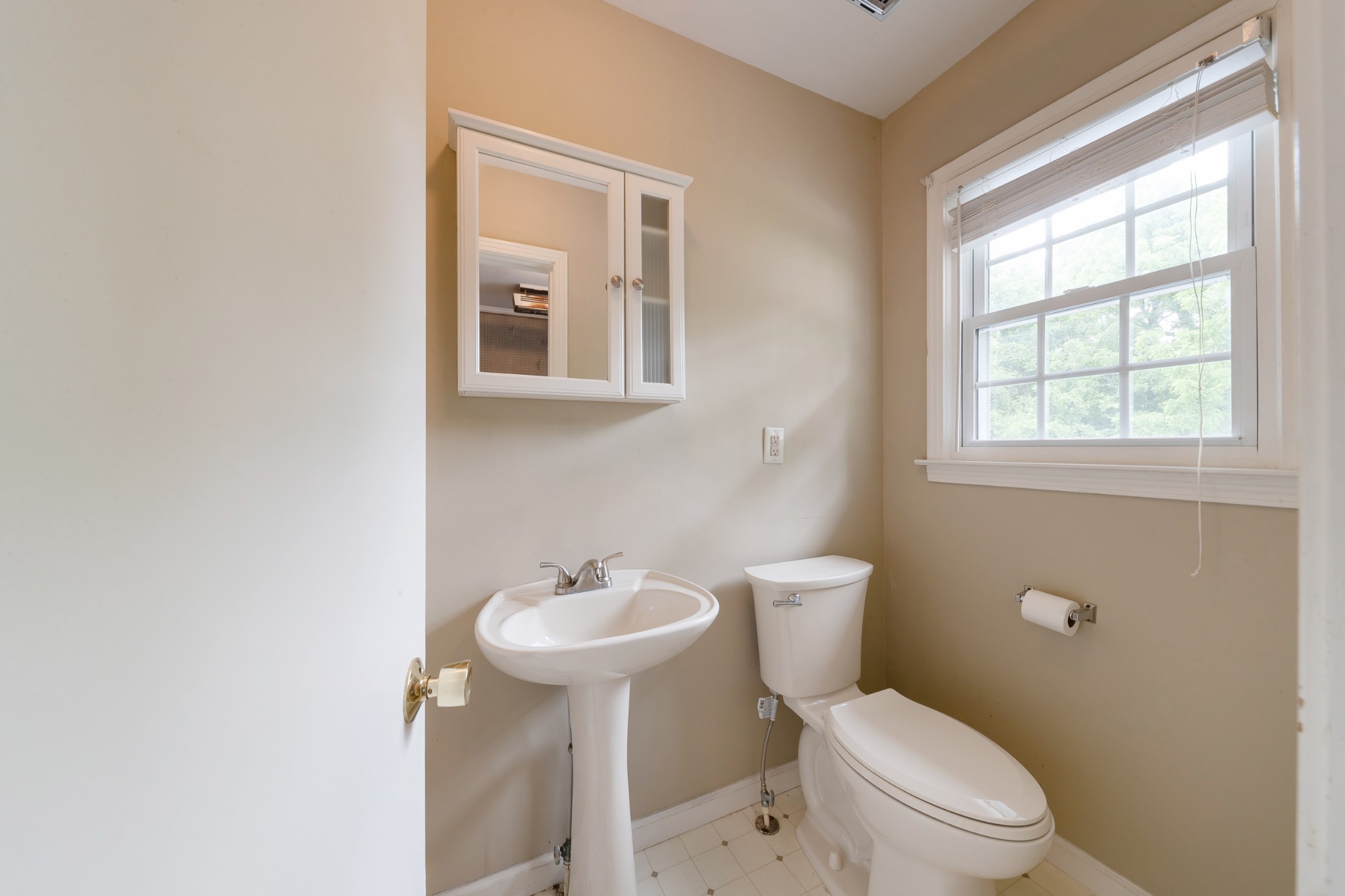 1265 Iron Bridge Road Columbia, TN 38401 - Photo 25 of 34 a bathroom with a toilet sink vanity and mirror