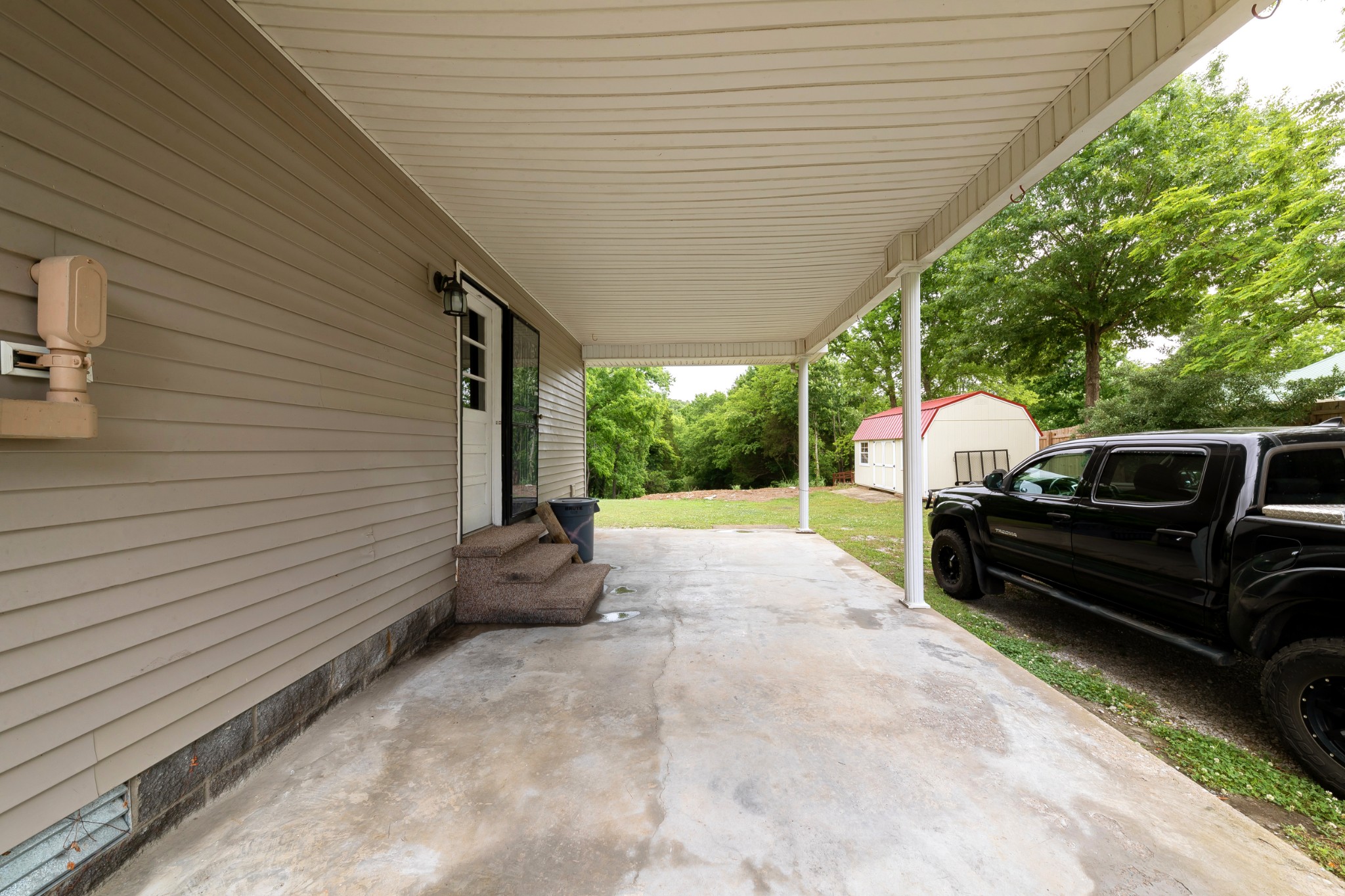 1265 Iron Bridge Road Columbia, TN 38401 - Photo 28 of 34 a view of a backyard with sitting area