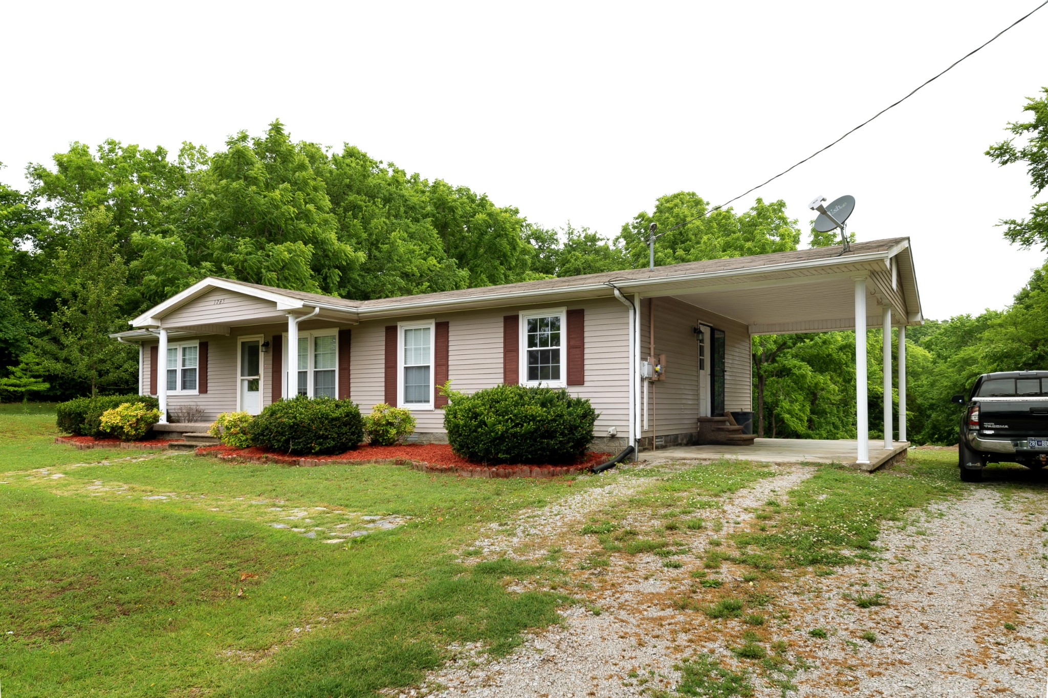 1265 Iron Bridge Road Columbia, TN 38401 - Photo 3 of 34 a front view of a house with yard and green space