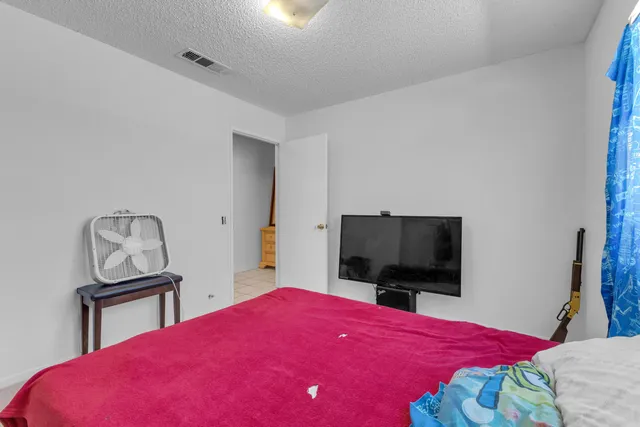 a bedroom with a bed and a walk in closet