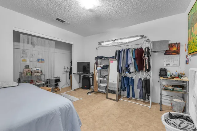 a bathroom with a sink a toilet and shower curtain