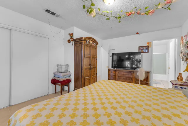 a bathroom with a sink vanity mirror and toilet