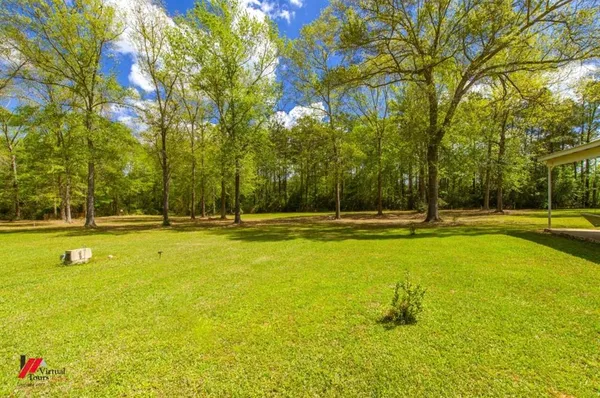 a view of swimming pool with an outdoor space and seating area