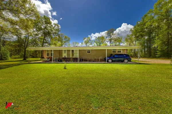 a view of a house with a big yard