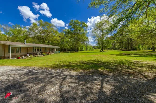 a view of a house with a big yard