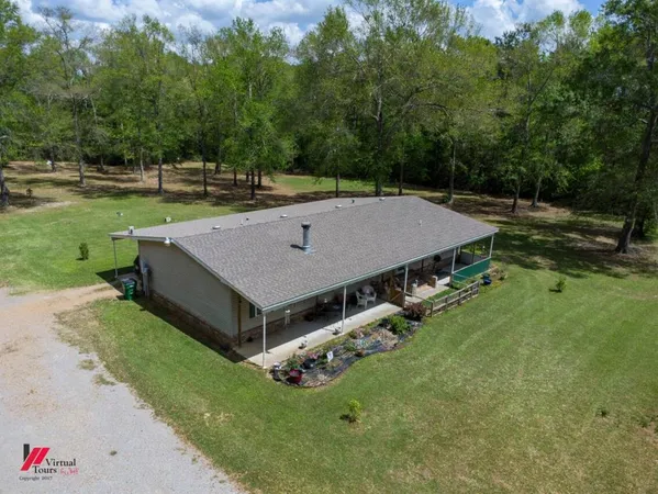an aerial view of a house having yard