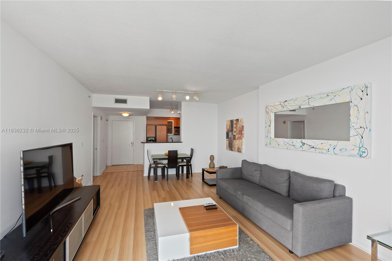 335 South Biscayne Boulevard, Unit 3410 Miami, FL 33131 - Photo 23 of 51 a living room with furniture and a fireplace